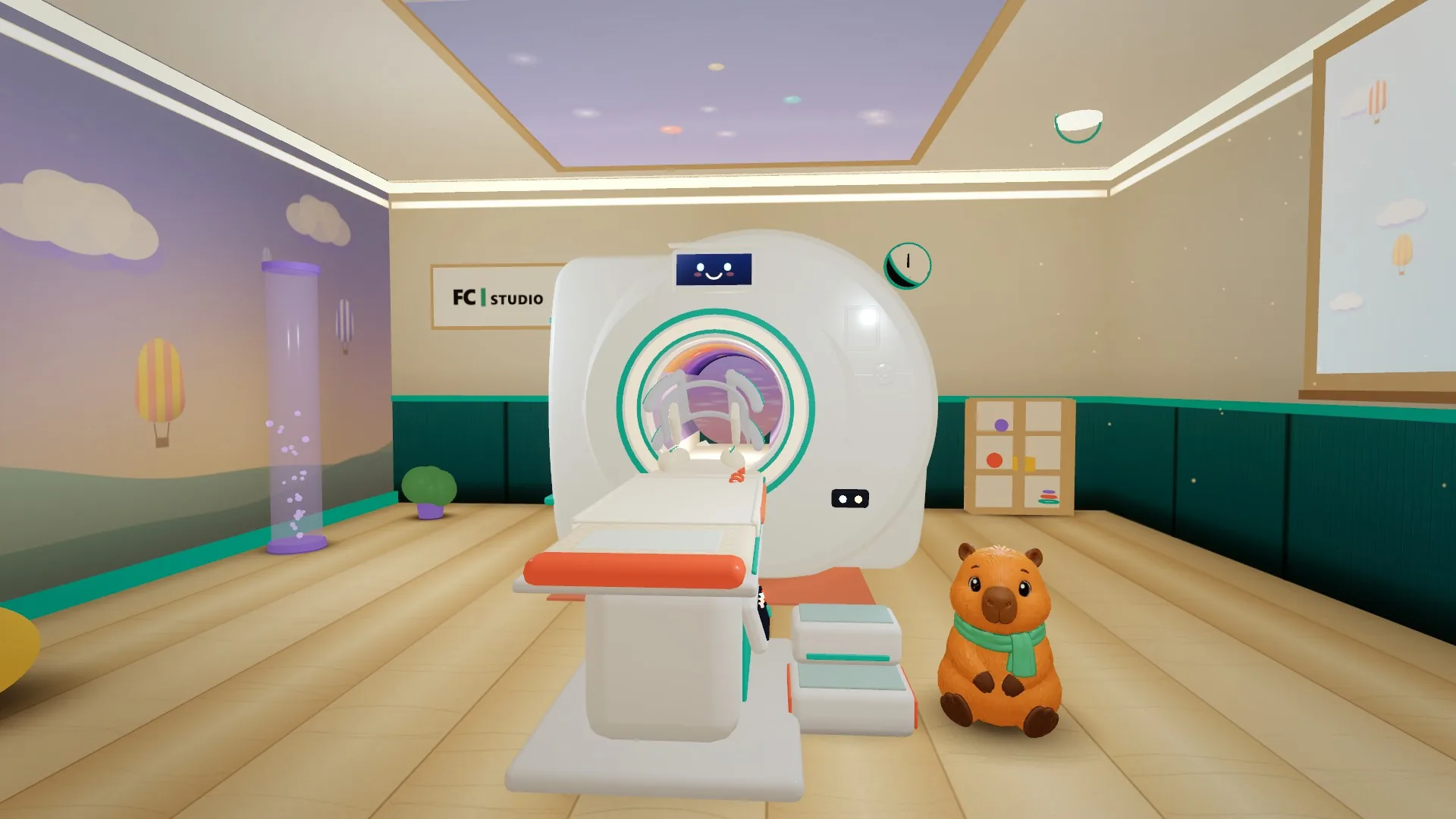 Sala de resonancia virtual con el resonador, la camilla y Capi, la mascota, junto a un cartel de FC Studio.
